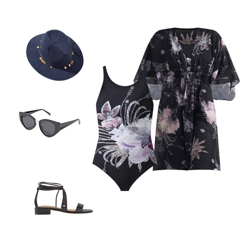 Chicos outfit featuring a dark navy straw hat with beading detail, Black and purple floral one piece swimsuit, black and floral kimono cover up, black cat eye sunglasses with gold detailing, and black heeled sandals for the eTail West Style Edit. 