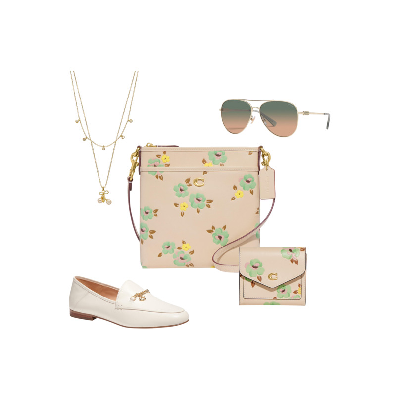 Coach beige leather crossbody messenger bag with turquoise and yellow pastel flowers, with matching wallet, white loafers, blue and tan ombre aviator sunglasses and a double tiered gold necklace for the eTail West Stylitics edit
